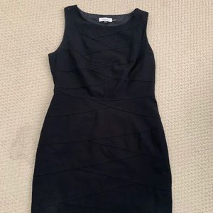 Slender, sleeveless little black dress